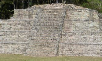 A UNESCO World Heritage Site famous for its intricately carved sculptures and where scarlet macaws often soar overhead